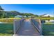 Wooden pier extending over a pond in a community at 199 Schooner Bend Ave, Summerville, SC 29486