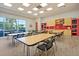 Well-lit community room with tables and chairs, and storage at 199 Schooner Bend Ave, Summerville, SC 29486