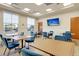 Bright community room with tables and chairs, perfect for gatherings at 199 Schooner Bend Ave, Summerville, SC 29486