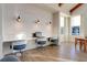 Modern co-working space with three workstations, white marble desk, and blue chairs at 199 Schooner Bend Ave, Summerville, SC 29486
