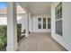 Bright and airy covered porch with white columns and windows at 199 Schooner Bend Ave, Summerville, SC 29486