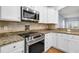 Stainless steel appliances and granite countertops in this kitchen at 199 Schooner Bend Ave, Summerville, SC 29486