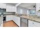 Modern kitchen with granite counters, island, and stainless steel appliances at 199 Schooner Bend Ave, Summerville, SC 29486