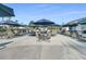 Relaxing patio area with tables and umbrellas at 199 Schooner Bend Ave, Summerville, SC 29486