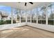 Bright sunroom with wall-to-wall windows and carpet flooring at 199 Schooner Bend Ave, Summerville, SC 29486