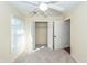 Bedroom with ceiling fan, window with blinds, and built-in closet at 208 Buckskin Dr, Summerville, SC 29486