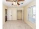 Bright bedroom featuring a ceiling fan and ample closet space at 208 Buckskin Dr, Summerville, SC 29486