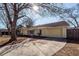 Nice yellow ranch home with a large driveway and mature trees at 208 Buckskin Dr, Summerville, SC 29486