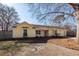 Ranch style home with yellow siding, mature trees, and a spacious yard at 208 Buckskin Dr, Summerville, SC 29486