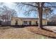 Charming yellow ranch home with a large front yard and mature trees at 208 Buckskin Dr, Summerville, SC 29486