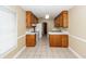 Kitchen features wood cabinets, tile floors, and white appliances at 208 Buckskin Dr, Summerville, SC 29486