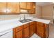 Kitchen with double sink and wood cabinets at 208 Buckskin Dr, Summerville, SC 29486