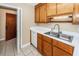 Kitchen features double sink, wood cabinets, and dishwasher at 208 Buckskin Dr, Summerville, SC 29486