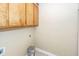 Laundry room with wood cabinets and tile floor at 208 Buckskin Dr, Summerville, SC 29486