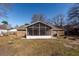 Screened porch attached to brick home, perfect for relaxing at 208 Buckskin Dr, Summerville, SC 29486