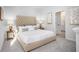 Main bedroom with tufted headboard and ensuite bathroom at 211 Pine Crest View Dr, Summerville, SC 29486