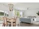 Open concept dining area with view to living room and patio at 216 Pine Crest View Dr, Summerville, SC 29486