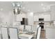 Modern kitchen with white cabinets, island, and stainless steel appliances at 216 Pine Crest View Dr, Summerville, SC 29486
