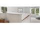 Bright loft area overlooking main level with large windows and cozy sitting area at 216 Pine Crest View Dr, Summerville, SC 29486