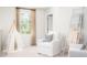 Cozy bedroom with a comfortable armchair and plenty of natural light at 223 Pine Crest View Dr, Summerville, SC 29486