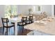 Modern dining area with white table and black chairs at 223 Pine Crest View Dr, Summerville, SC 29486
