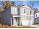 Two-story gray house with white garage door and landscaping at 223 Pine Crest View Dr, Summerville, SC 29486