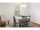 Bright dining room with a white table and gray chairs near a window at 2236 Bailey Dr, North Charleston, SC 29405