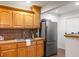 Efficient kitchen with wood cabinets, stainless steel appliances, and tile flooring at 2236 Bailey Dr, North Charleston, SC 29405
