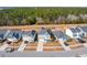 Aerial view of houses, street, and surrounding trees at 230 Granton Edge Ln, Summerville, SC 29486