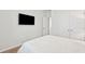 Bedroom with a mounted TV and white bedding at 230 Granton Edge Ln, Summerville, SC 29486