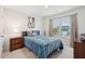 Spacious bedroom with a queen-sized bed and wood dresser at 230 Granton Edge Ln, Summerville, SC 29486