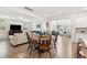 Bright dining room features a table with six chairs and hardwood floors at 230 Granton Edge Ln, Summerville, SC 29486