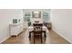 Elegant dining room with hardwood floors, chandelier, and white cabinetry at 230 Granton Edge Ln, Summerville, SC 29486