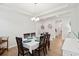 Spacious dining room with hardwood floors and a charming chandelier at 230 Granton Edge Ln, Summerville, SC 29486