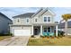 Two-story house with gray siding, white trim, and a front porch at 230 Granton Edge Ln, Summerville, SC 29486