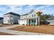 Two story house, gray siding, landscaping, and driveway at 230 Granton Edge Ln, Summerville, SC 29486