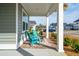 Front porch with teal chairs and a small table at 230 Granton Edge Ln, Summerville, SC 29486