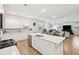 Open concept kitchen with island seating and stainless steel appliances at 230 Granton Edge Ln, Summerville, SC 29486