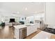 Open concept kitchen showcasing stainless steel appliances and an island that overlooks the living room at 230 Granton Edge Ln, Summerville, SC 29486