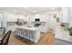 Bright kitchen featuring white cabinets, an island with seating, and stainless steel appliances at 230 Granton Edge Ln, Summerville, SC 29486