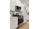 Stainless steel appliances and white shaker cabinets in this modern kitchen at 230 Granton Edge Ln, Summerville, SC 29486