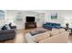 Cozy living room with hardwood floors, fireplace, and comfy sofas at 230 Granton Edge Ln, Summerville, SC 29486