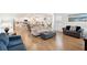Open concept living room with hardwood floors and kitchen view at 230 Granton Edge Ln, Summerville, SC 29486