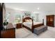 Large main bedroom with plush carpeting and wooden furniture at 230 Granton Edge Ln, Summerville, SC 29486