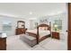 Spacious main bedroom with plush carpeting and wooden furniture at 230 Granton Edge Ln, Summerville, SC 29486