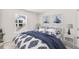 Bright bedroom with a queen-size bed and nautical-themed decor at 253 Pine Crest View Dr, Summerville, SC 29486
