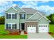 Two-story house with two-car garage and brick accents at 253 Pine Crest View Dr, Summerville, SC 29486
