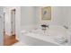 Bathroom with a large, luxurious jacuzzi tub, and white tile at 3019 Brownell Ave, Sullivans Island, SC 29482