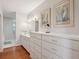 Elegant bathroom with double vanity, large drawers, and hardwood floors at 3019 Brownell Ave, Sullivans Island, SC 29482