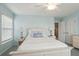 Bedroom with white wooden bed frame and light blue walls at 3019 Brownell Ave, Sullivans Island, SC 29482